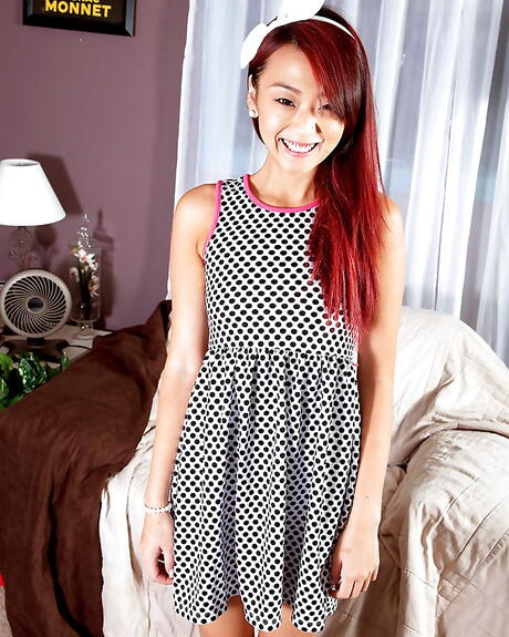 Slender asian redhead young Layla Mynxxx in fancy skirt reveals small tits and butt 